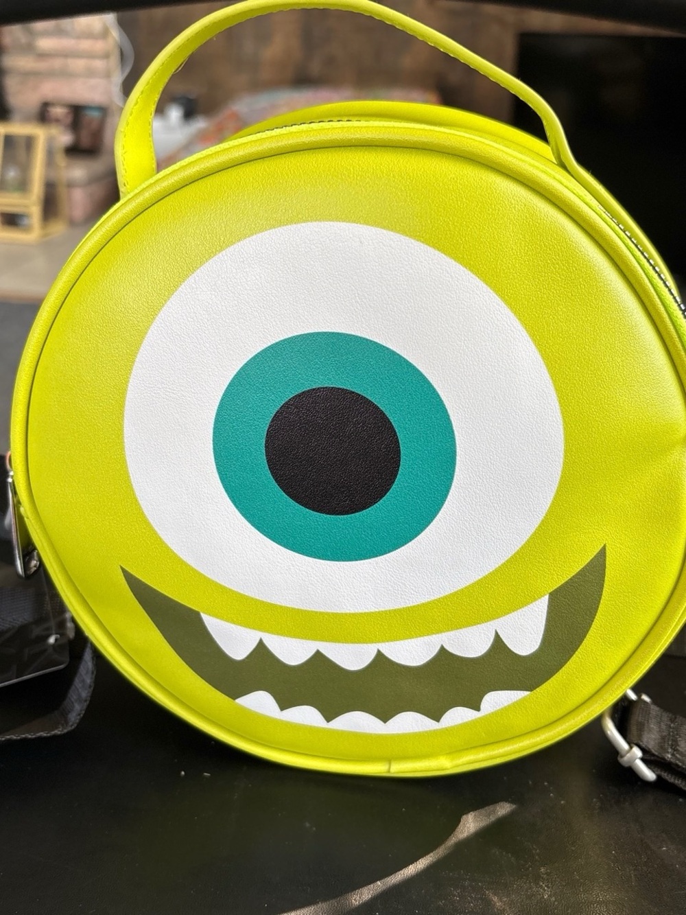 Buckle-Down Lime Green One-Eyed Monster Round Crossbody Bag